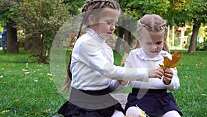 Two sisters in an autumn park