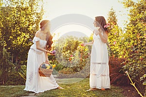 Two sisters and basket of harvest