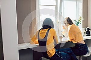 Two sisters drinking tea in the morning