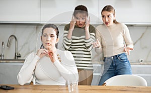 Two sisters during family quarrel accuse woman photo