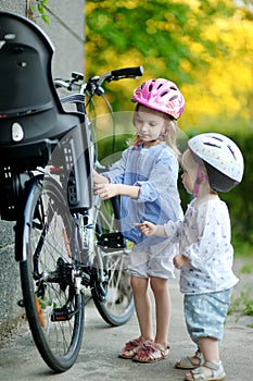 Two sisters going to have a bicycle ride