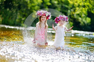 Two sisters having fun by a river