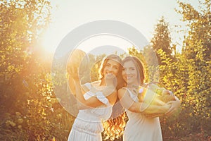 Two sisters are holding crop