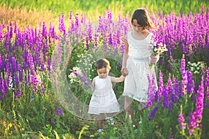 Two sisters holding hands in the flower chain