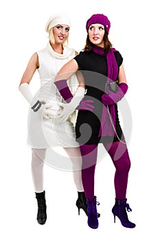 Two sisters in knit wool hat and mittens