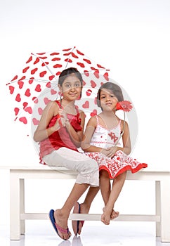 Two sisters in red and white theme