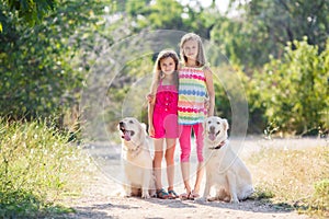 Two sisters on a walk with the dogs in the park