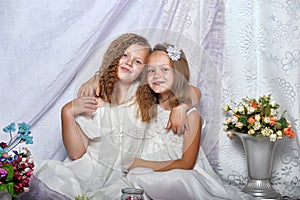 Two sisters in white dresses