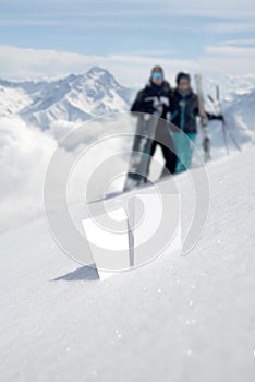 Two ski admission tickets in snow