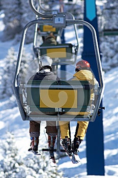 Two skiers on elevator