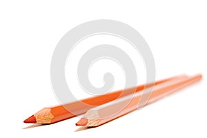 Two skin colored pencils isolated on a white background