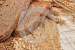 Two slices of bread with fresh ears wheat, dry beans of wheat, f