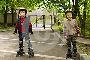 Two small boys kitted out for roller skating