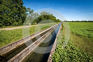 Two Small Concrete Irrigation Canals in the Countryside - Padan Plain Italy