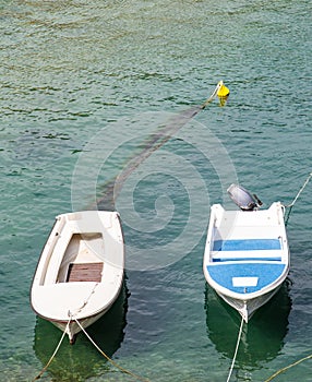 Two Small Fishing Boats in Blue Water