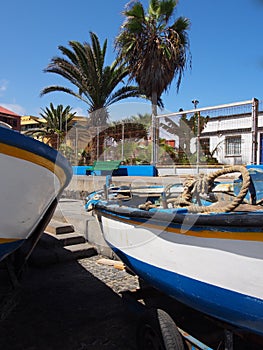 Two small fishing boats on a harbor