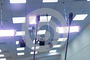 Two small microphones on the podium for public speaking