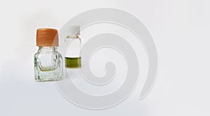 two small perfume or attar bottles isolated in white background with selective focus