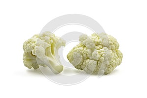 Two small pieces fresh organic cauliflower on white isolated background with clipping path. Cauliflower have high carbohydrate and