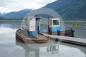 Two small tugs used for pushing rafted logs.