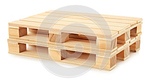 Two small wooden pallets stacked on white background