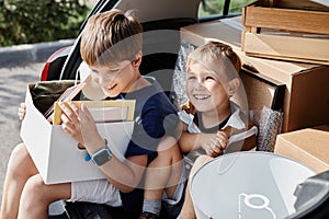 Two Smiling Boys Moving House