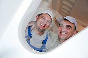 Two smiling construction workers