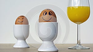 Two smiling funny eggs