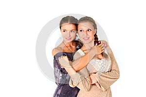 Two smiling girls girlfriend hugging isolated on white background