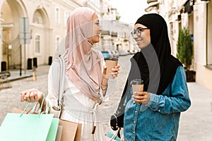 Two smiling mid aged islamic women