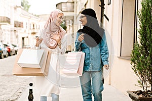 Two smiling mid aged islamic women