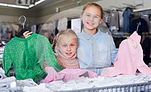 Two smiling sisters during family shopping