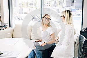 Two smiling women communication and friendship concept