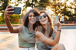 Two smiling young girls having fun