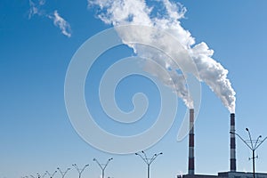 Two smoking chimneys pollution air