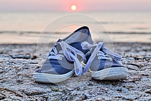 Two sneakers at the beach