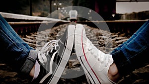 Sneakers on railway