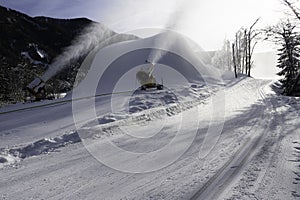 Two snow cannons in action