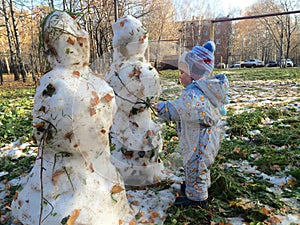 Two snowmen and baby