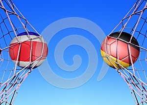 Two soccer balls in flags Costa rica and Germany