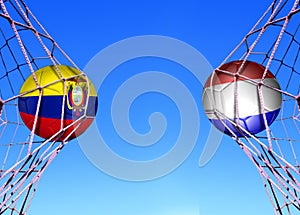 Two soccer balls in flags ecuador and Hlland