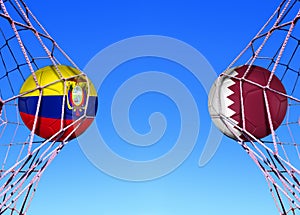 Two soccer balls in flags ecuador and Qatar