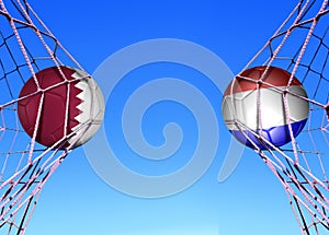 Two soccer balls in flags qater  and Hlland