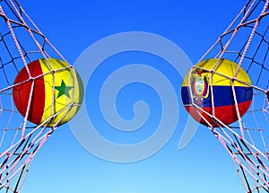 Two soccer balls in flags senegal and Ecuador