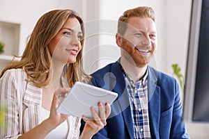 Two software developers working in an office