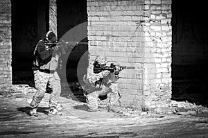 Two soldier in combat gear. black and white
