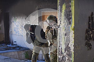 Two soldiers in combat gear