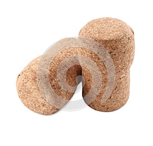 Two sparkling wine corks on white background