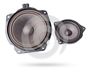 Two speakers of an acoustic system - an audio for playing music in a car interior on a white isolated background in a photo studio