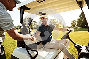 Two sportsmen shaking hands